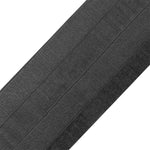 Close-up of SMAI Dollamur Flexi-Roll Tatami Seam Tape in black, featuring tatami-textured stitching lines, displayed diagonally against a white background. The detailed surface matches that of Dollamur Flexi-Roll mats.