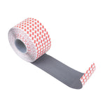 The SMAI Dollamur Flexi-Roll Tatami Seam Tape in dark grey features a gray adhesive side and white backing with red print, ideal for securing Dollamur Flexi-Roll or tatami surfaces.