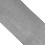 Close-up of SMAI Dollamur Flexi-Roll Tatami Seam Tape in dark grey, highlighting its tatami textured surface and parallel lines running along the tape’s width.