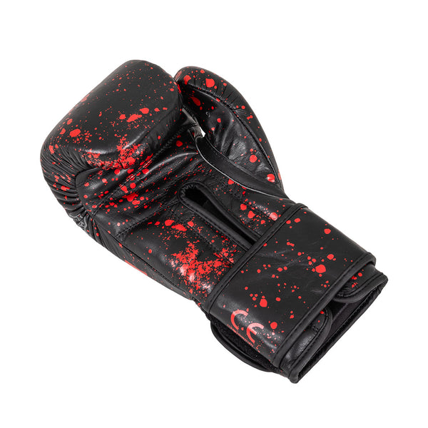 The SMAI Boxing Glove - Black Dragon Limited Edition, crafted from durable black cowhide leather with red splatter accents, features visible stitching, a glossy injection-moulded design, CE marking, and a wide wrist strap.