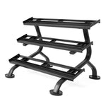 The SMAI 3 Tier Dumbbell Rack - Heavy Duty Commercial Grade features sturdy black metal shelves with an angled design, ideal for organizing rubber hex dumbbells, and stands stable on four round, flat feet.