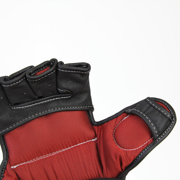 A close-up of the SMAI Elite85 MMA Gloves - Black, highlighting the fingerless design with padded sections, detailed stitching, and textured cowhide leather on the thumb, palm, and fingers, set against a plain white background.