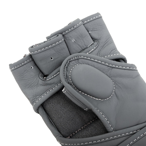 Close-up of SMAI Elite85 MMA Gloves - Charcoal, featuring visible stitching and padded areas that highlight the premium gray cowhide leather material and professional craftsmanship.