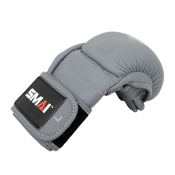 The Elite85 MMA Hybrid Sparring Glove by SMAI is a single charcoal glove with a black Velcro strap, featuring the SMAI logo in white and red, shown against a white background.