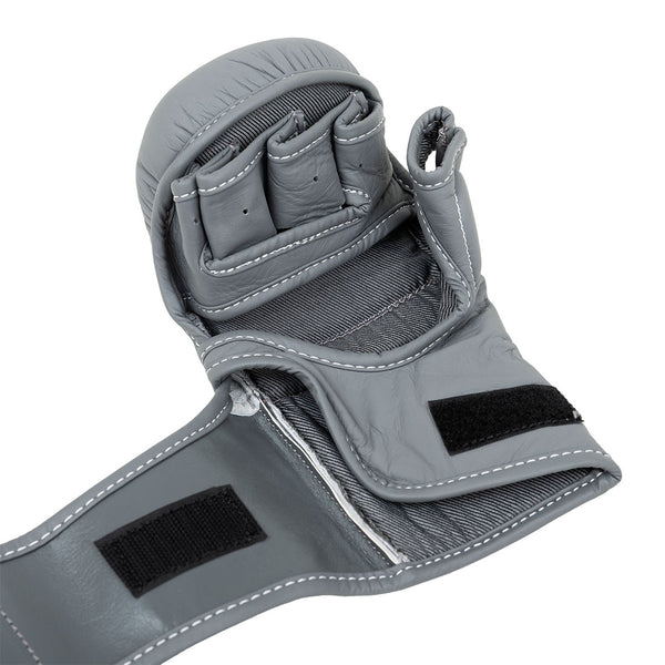 A close-up of the SMAI Elite85 MMA Hybrid Sparring Glove in charcoal, showcasing an open palm design, finger slots, Velcro straps for secure fit, and detailed white stitching—ideal for MMA or sparring.