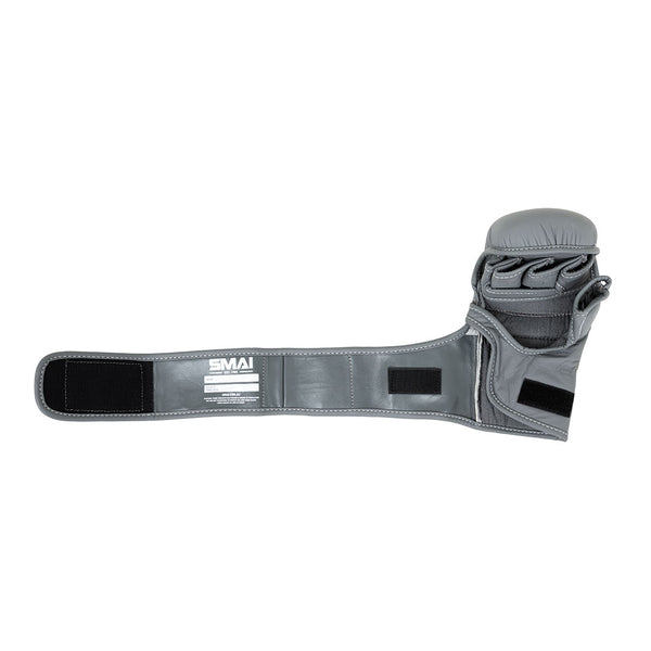 A single SMAI Elite85 MMA Hybrid Sparring Glove in charcoal is shown open to reveal the inside, featuring an extended wrist strap with velcro fastenings and the SMAI brand label.