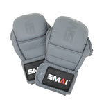 A pair of Elite85 MMA Hybrid Sparring Gloves in charcoal by SMAI, featuring black wrist straps with the white and red "SMAI" logo, are shown overlapping on a white background.