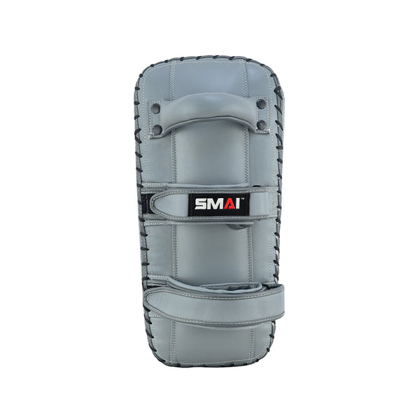 The SMAI Elite85 Muay Thai Pads V2 (Pair) in charcoal have two arm straps, a rear handle, reinforced stitching, impact-absorbing foam edges, and display the SMAI logo in black, white, and red. Made from high-grade leather.