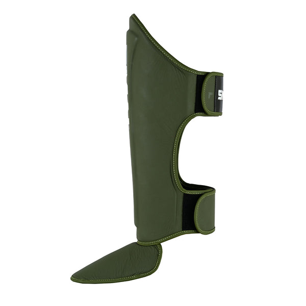 The SMAI PRE ORDER: Elite85 Muay Thai Shin Guards in olive green feature stitched edges, adjustable Velcro straps, and shin/instep padding, providing lightweight comfort and secure protection for martial arts or kickboxing.