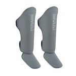 A pair of SMAI Elite85 Muay Thai Shin Guards in charcoal, designed for martial arts protection.