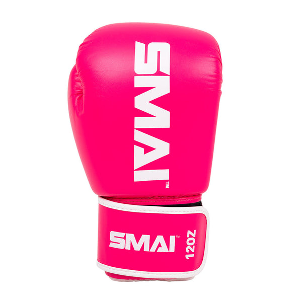 The Essentials Boxing Glove - Pink by SMAI features bold white branding on the top and wrist strap displaying "12 OZ," shown against a white background.