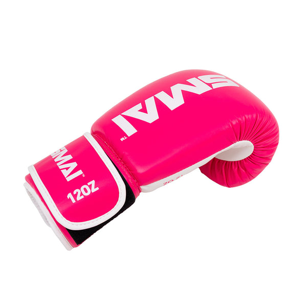 The SMAI Essentials Boxing Glove - Pink features bold white "SMAI" and "12 OZ" labels, shown solo against a plain white background—ideal for those seeking quality training or sparring gloves.
