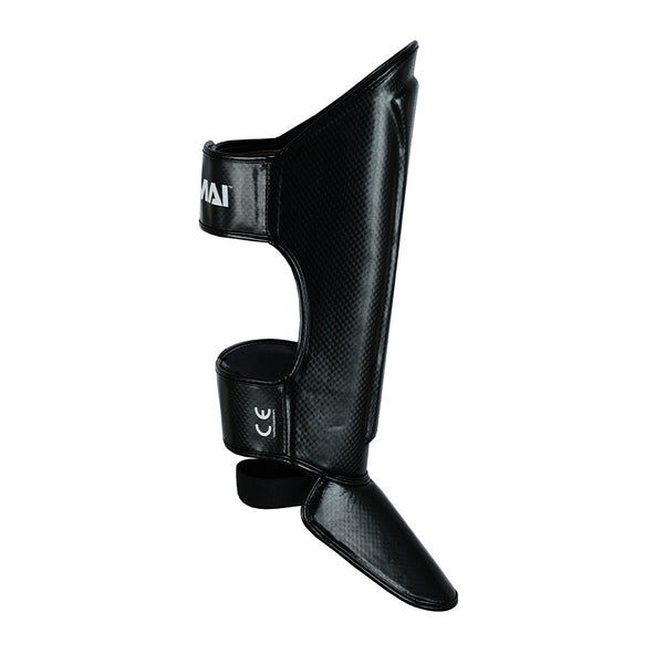 The SMAI Essentials Muay Thai Shin Guards Kids - Black offer adjustable straps and a textured surface, combining shin and instep protection—ideal sports gear for children training in martial arts or needing added sports protection.