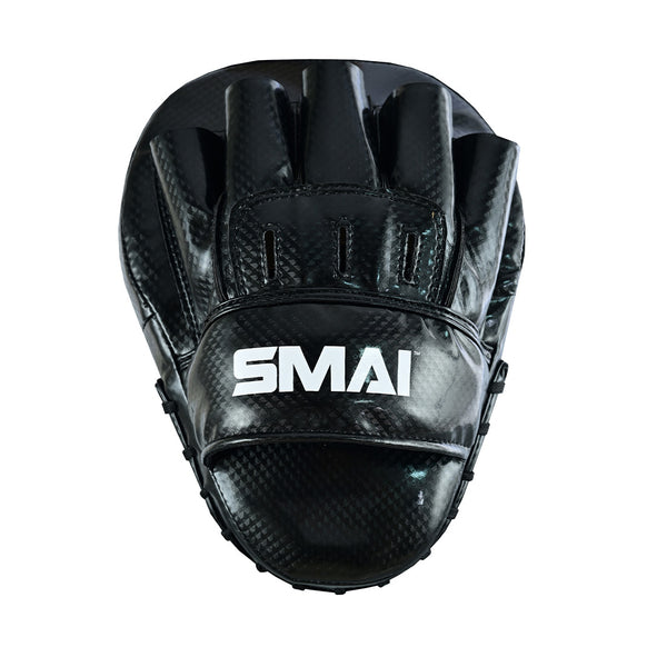 The SMAI Essentials Boxing Mitts - Black feature a carbon fiber texture, front view showing finger slots and wrist strap, designed for Muay Thai and martial arts training.
