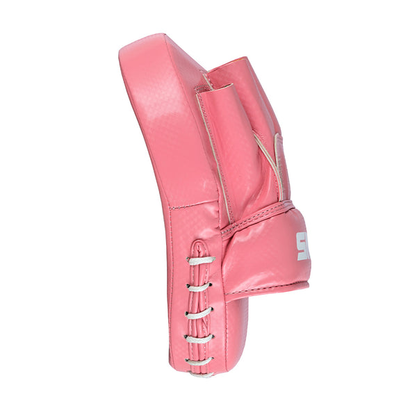 The Essentials Boxing Mitts - Pink by SMAI are shown from the side, featuring white stitching, lacing on the edge, and part of a white logo on the front—their shape resembles a goalie blocker or punching pad.