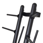 Here's a rephrased version of the sentence using the given product data:

A detailed view of the Pump Set - Storage Rack Only by SMAI, showcasing its black metal construction with multiple pegs designed for holding pump plates. This elegant design features robust vertical and horizontal bars set against a plain white background, making it an ideal solution for organizing your gym essentials.