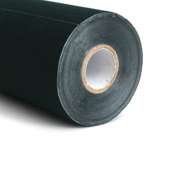 A close-up image features a large roll of SMAI's Turf Tape, a black landscape fabric with a visible cardboard core, designed for gardening and landscaping purposes, set against a plain white background.