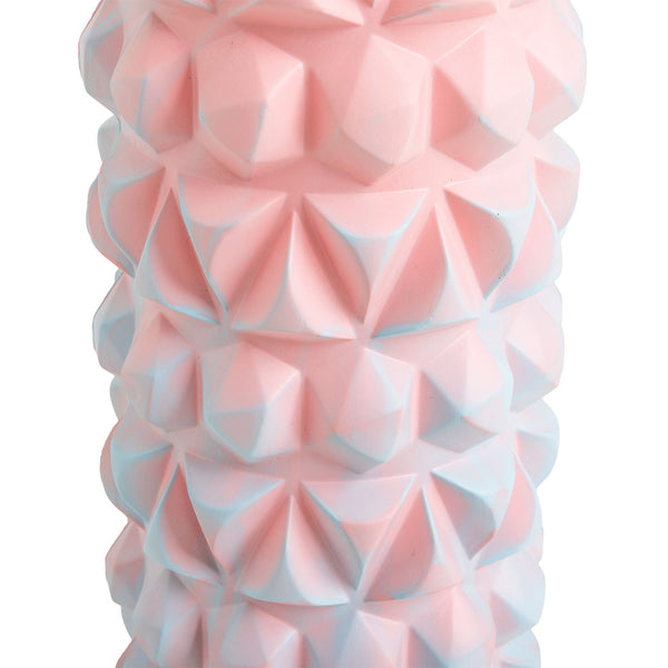 A close-up of the SMAI Foam Roller - Trigger Point in pink, featuring geometric, pyramid-like textures with light blue accents, designed to support muscle recovery.