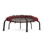 The SMAI Folding Rebounder Mini Trampoline 45" features a black jumping surface, black legs, and red bungee cords⁠—a compact fitness solution perfect for home workouts.