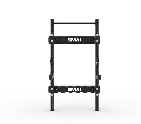 The SMAI Folding Wall Mounted Squat Rack, featuring the brand's logo on its horizontal support bars, is a black metal squat rack designed for easy folding to optimize garage gym spaces, and is pictured standing upright against a plain white background.