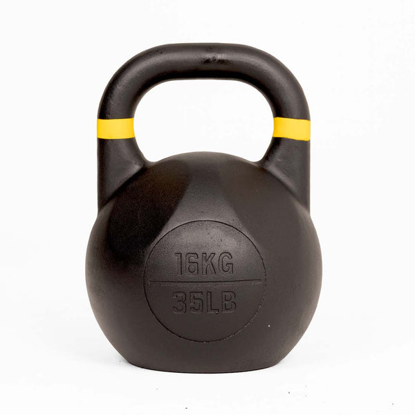 A black SMAI Competition Kettlebell - Fusion Series, featuring yellow stripes near the handle and marked with “16KG” and “35LB” on the front, has a consistent size and a large handle for a reliable grip, and is displayed on a white background.