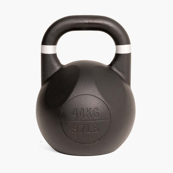 A SMAI Fusion Series Competition Kettlebell in black, featuring a large handle and marked with “44 KG” and “97 LB” on the front, is positioned upright against a plain white background.
