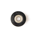 The SMAI Air Ski Machine Spare Part is a black plastic replacement bungee cord pulley with a metal ball bearing center, viewed from above on a white background.