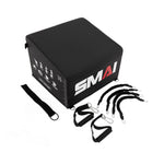 A black SMAI Hip Thrust Box with height markings comes with resistance bands, handles, and a strap, all displayed on a white background.