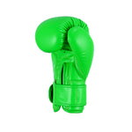 The SMAI Essentials Kids Boxing Glove in bright green is displayed upright against a plain white background, featuring a secured wrist strap for added safety.