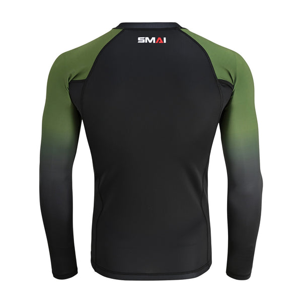 The SMAI Long Sleeve Rash Guard - Olive Green features a black back, green gradient sleeves, and the SMAI logo at the upper center—perfect as a no-gi grappling top or compression shirt.