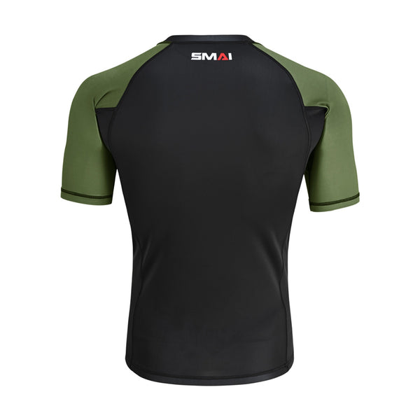 Back view of the SMAI Short Sleeve Rash Guard - Olive Green, featuring a black body, olive green sleeves and shoulders, with the "SMAI" logo displayed near the upper back neckline.