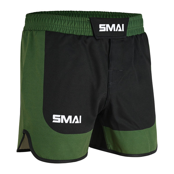 SMAI MMA Grappling Shorts in Black/Olive Green feature a white "SMAI" logo on the waistband and left leg, polycotton fabric, elastic waistband, Velcro closure, and a stretch gusset for comfort and mobility.