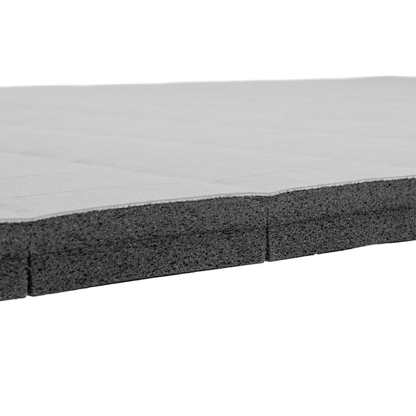Angled side view of the SMAI Roll Out Workout Mat – Dollamur Flexi Roll in light grey, featuring a textured surface and straight edges against a white background—ideal for home training.