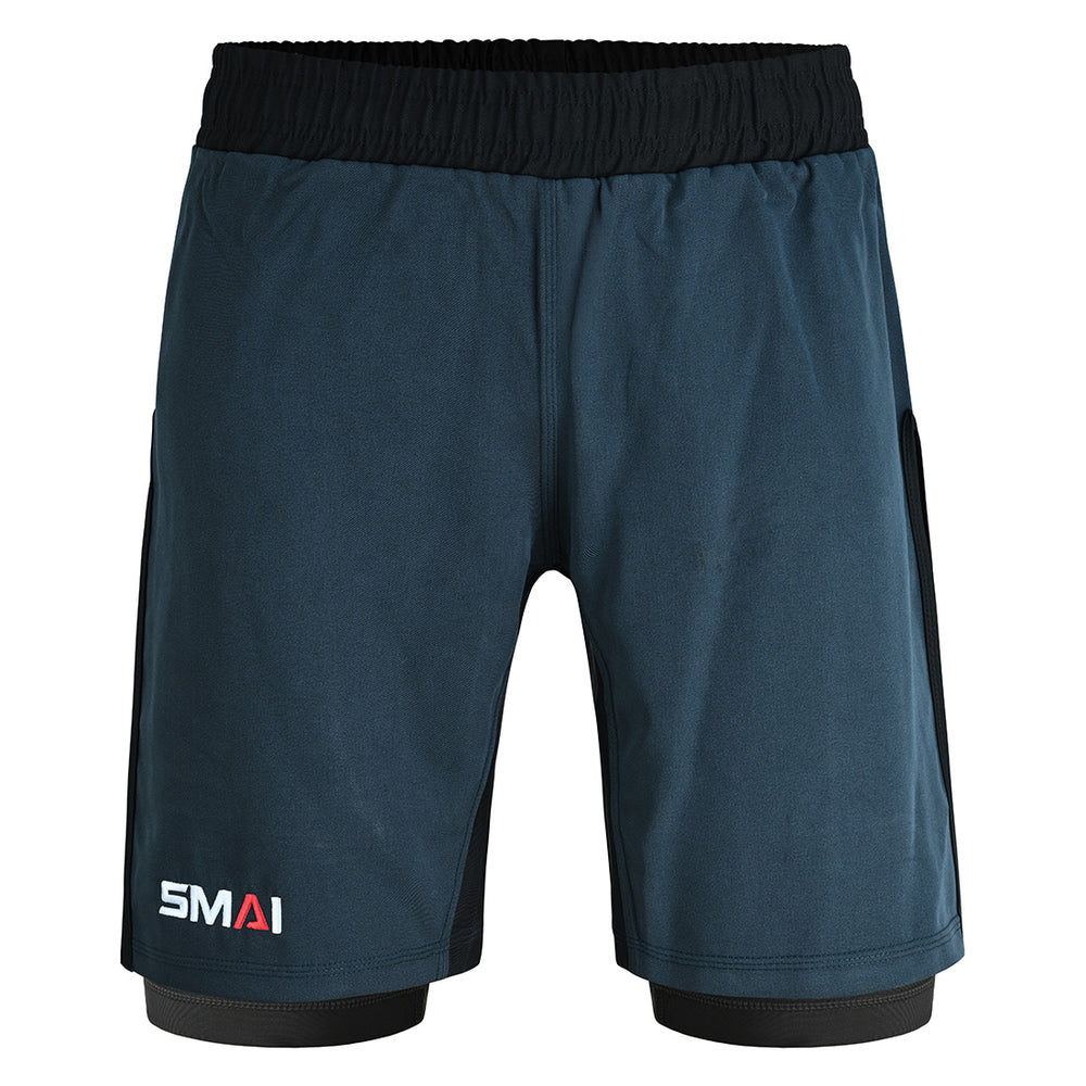 The SMAI Hybrid MMA Grappling Shorts in black and grey feature a black elastic waistband, side panels, and the "SMAI" logo in white and red on the lower left leg.