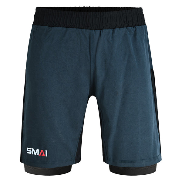 The SMAI Hybrid MMA Grappling Shorts in black and grey feature a black elastic waistband, side panels, and the "SMAI" logo in white and red on the lower left leg.