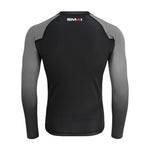 The Long Sleeve Rash Guard - Grey by SMAI features a black body, dark gray sleeves, and "SMAI" branding on the upper back near the neckline.