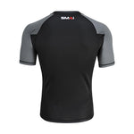 The SMAI Short Sleeve Rash Guard - Grey features gray sleeves and shoulders, a black body, and the "SMAI" logo near the back neckline—perfect for no-gi grappling or as a BJJ rashguard.