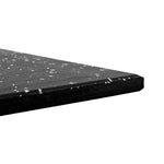 Close-up of the SMAI Rubber Gym Flooring Tile - 15mm - White Fleck, a flat, rectangular black rubber tile featuring small white flecks. The image highlights its thickness and textured, non-slip surface against a plain white background, demonstrating its suitability for gym flooring applications.