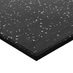 A close-up view of the SMAI Rubber Gym Flooring Tile - 15mm - Grey Fleck, shown at an angle to emphasize its substantial thickness and textured grey fleck surface.