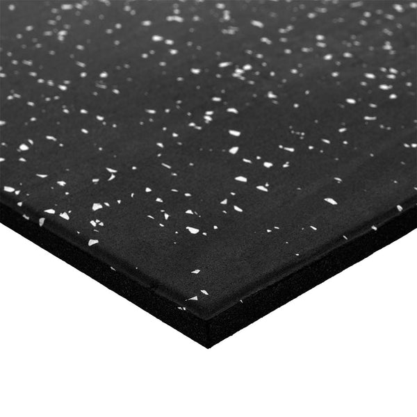A close-up view of the SMAI Rubber Gym Flooring Tile - 15mm - White Fleck, highlighting its corner to showcase the thickness and textured, non-slip surface—a durable and reliable option for gym flooring.