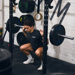 Man squatting HD Bumper Plates (Pair) - 20kg 2