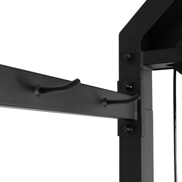 Close-up of a black metal frame with two angled hooks on the SMAI All-In-One Home Gym Trainer - Plate Loaded (Demo Stock). The image highlights the hooks and bolts, showcasing the machine's durable build for full-body workouts.