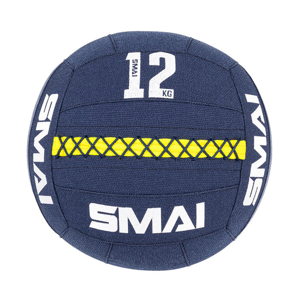 A blue SMAI Wall Balls - Hybrid Range ball with a yellow stitched stripe, "12 KG" in white text, durable aramid fibre construction, and bold SMAI branding around the ball.