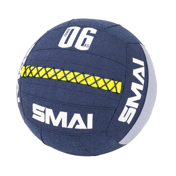 The SMAI Wall Balls - Hybrid Range in navy blue feature a yellow and black crisscross grip, white lettering, and "06 KG" on the upper panel—perfect for hybrid strength workouts.