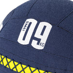 Close-up of a blue SMAI Wall Balls - Hybrid Range surface with "09 KG" and "SMAI" in white, plus yellow crisscross stitching near the base—perfect for hybrid strength training.