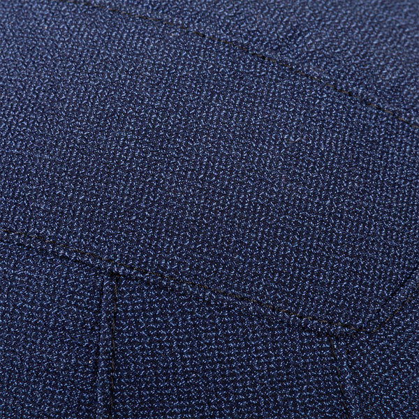 Close-up of textured dark blue fabric with visible stitching, resembling the durable material used in SMAI Wall Balls - Hybrid Range for strength training.