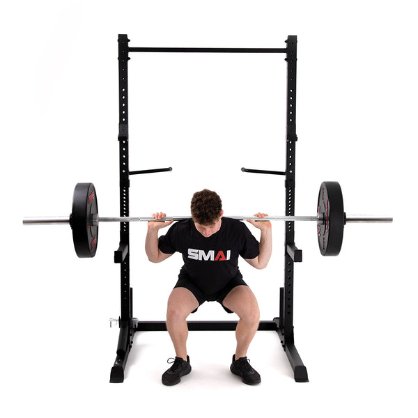 Man squatting using Squat Rack with Accessories