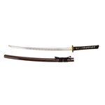 The SMAI High Carbon Steel Katana - Crimson Eclipse features a curved blade, black and gold handle, and comes with a separate dark brown scabbard placed below it.