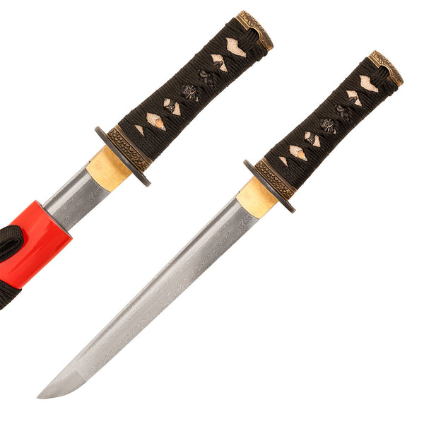 The SMAI Damascus Red Tiger Tanto features a patterned Damascus steel blade, black cord-wrapped handle with gold accents and decorative details, and a red sheath that partially covers the full tang blade.