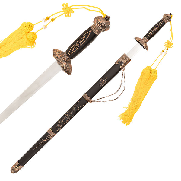 The SMAI Tai Chi Sword Jian Carbon Steel features a black and gold hilt, ornate guard, yellow tassels, and a matching scabbard with gold detailing and engravings. The blade is partially unsheathed for display.